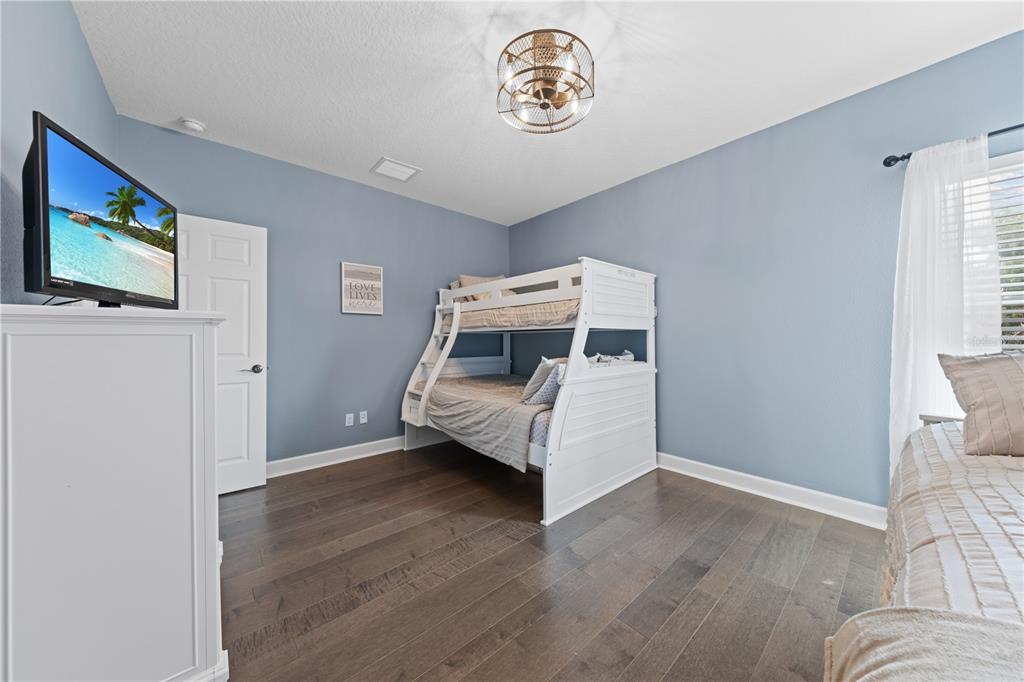 16948 Deer Island Road Tavares, FL 32778 - Photo 42 of 67 a bedroom with a bed and a window