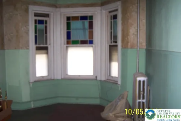 a bathroom with a bathtub and a window