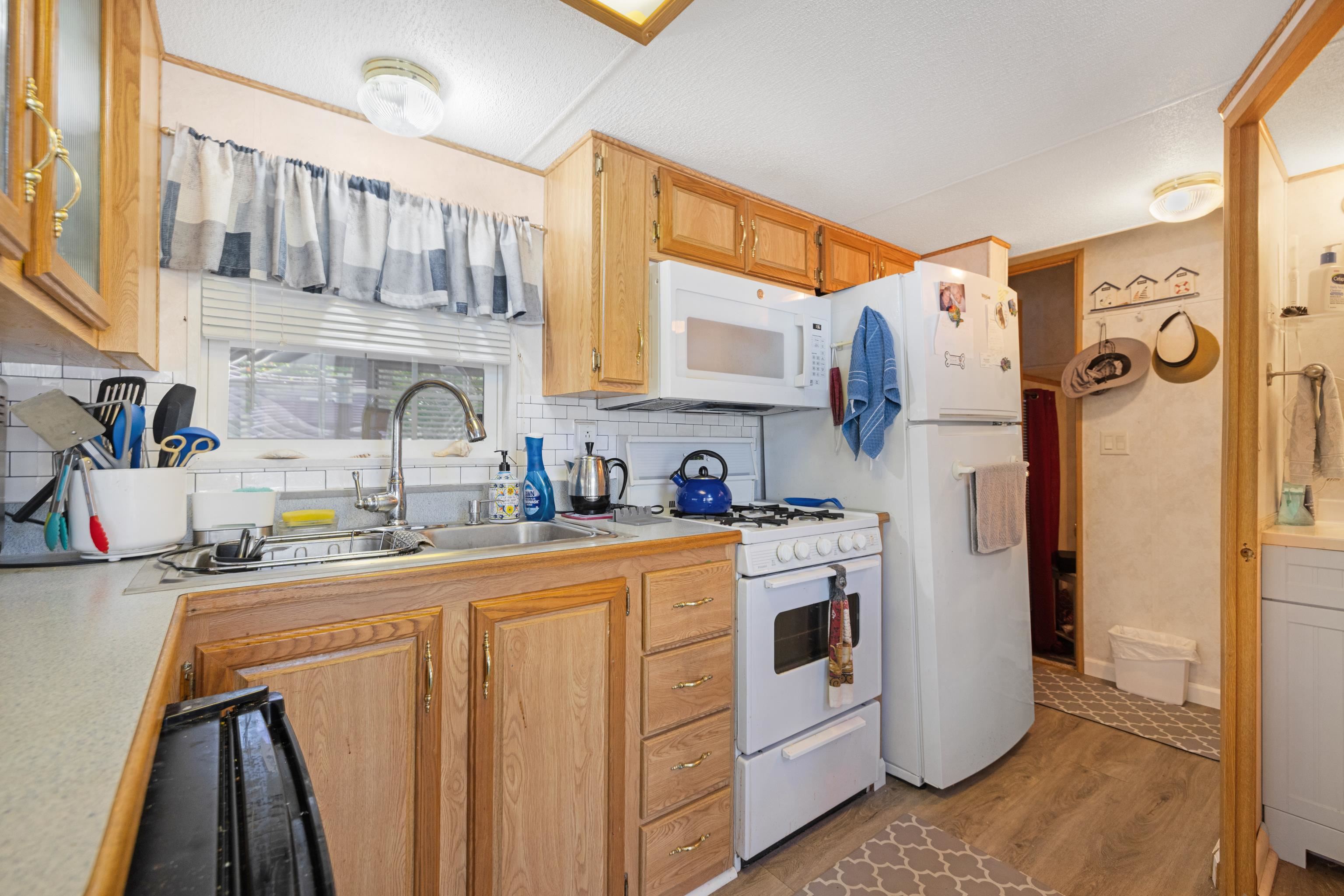 709 Rt 9 S, Unit 384 Cape May, NJ 08204 - Photo 11 of 22 a view of a kitchen with sink and refrigerator