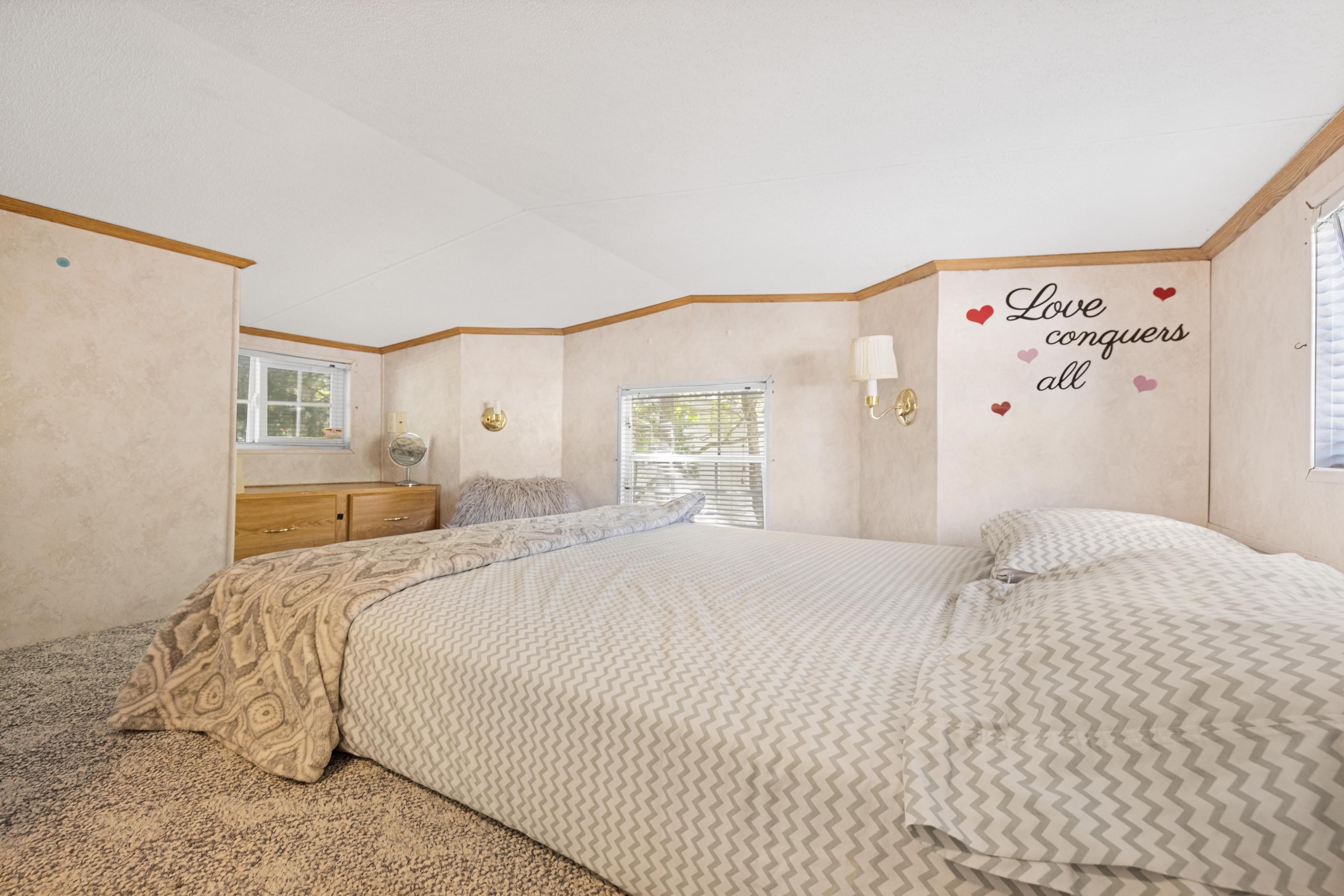 709 Rt 9 S, Unit 384 Cape May, NJ 08204 - Photo 13 of 22 a bedroom with a bed and a large mirror
