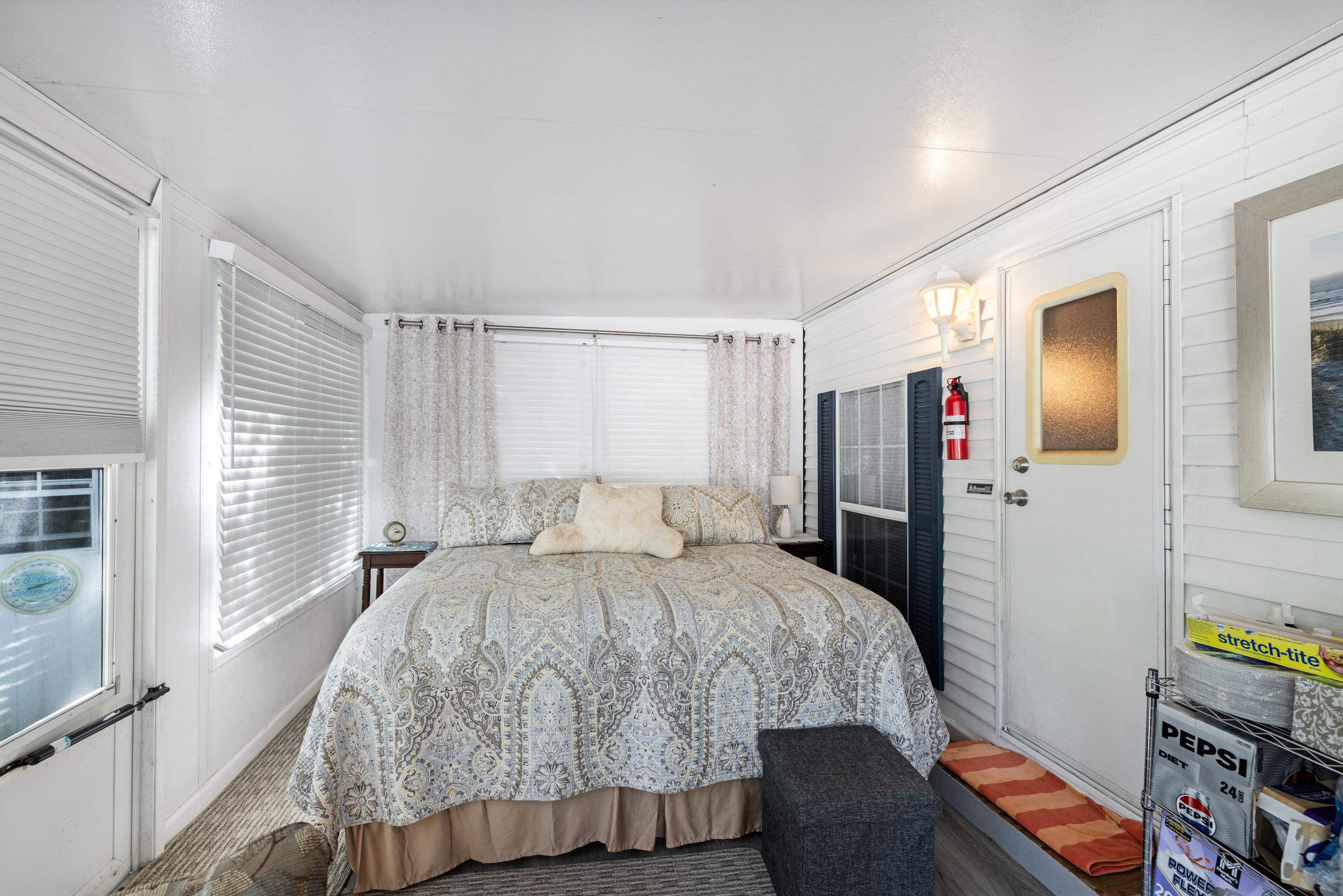 709 Rt 9 S, Unit 384 Cape May, NJ 08204 - Photo 14 of 22 a bedroom with a bed and wooden floor