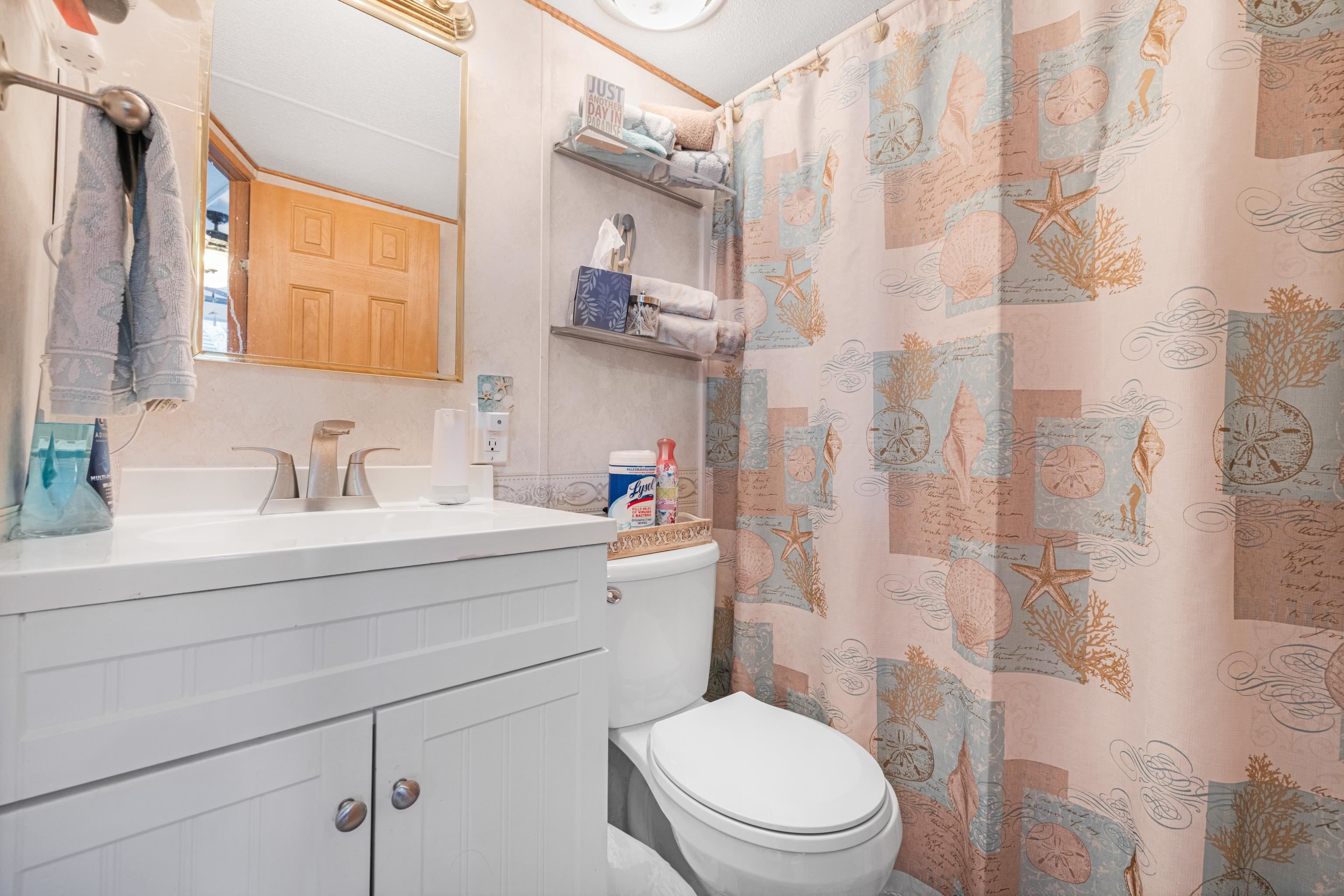 709 Rt 9 S, Unit 384 Cape May, NJ 08204 - Photo 18 of 22 a bathroom with a sink toilet vanity and shower