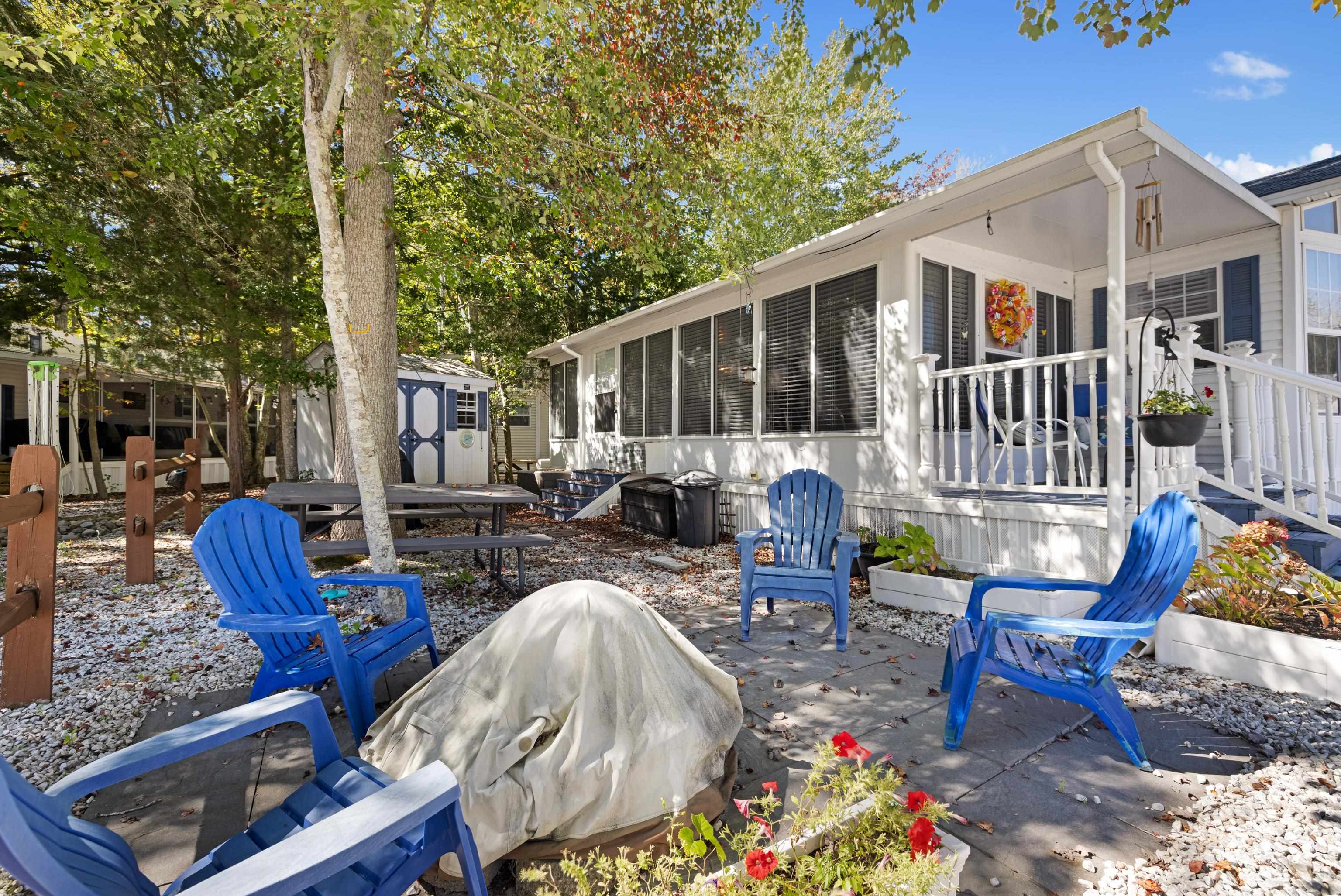709 Rt 9 S, Unit 384 Cape May, NJ 08204 - Photo 3 of 22 a view of a patio with couches table and chairs and potted plants