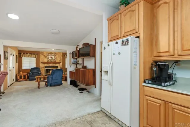 a kitchen with stainless steel appliances a refrigerator and cabinets
