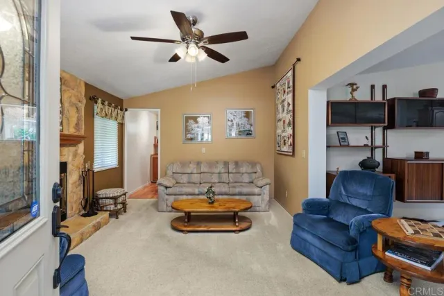 a living room with furniture gym equipment and a flat screen tv