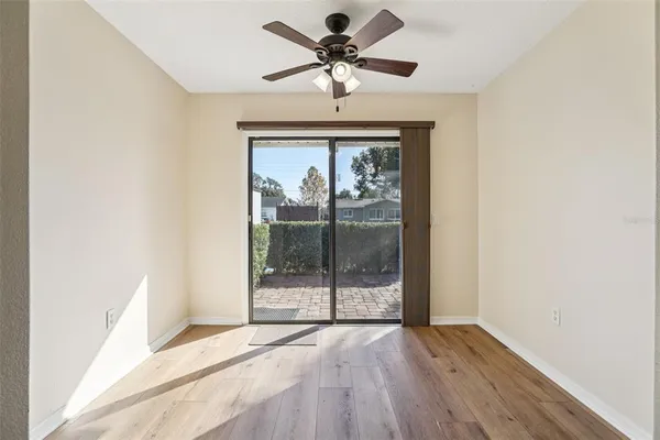 a view of an empty room with a window