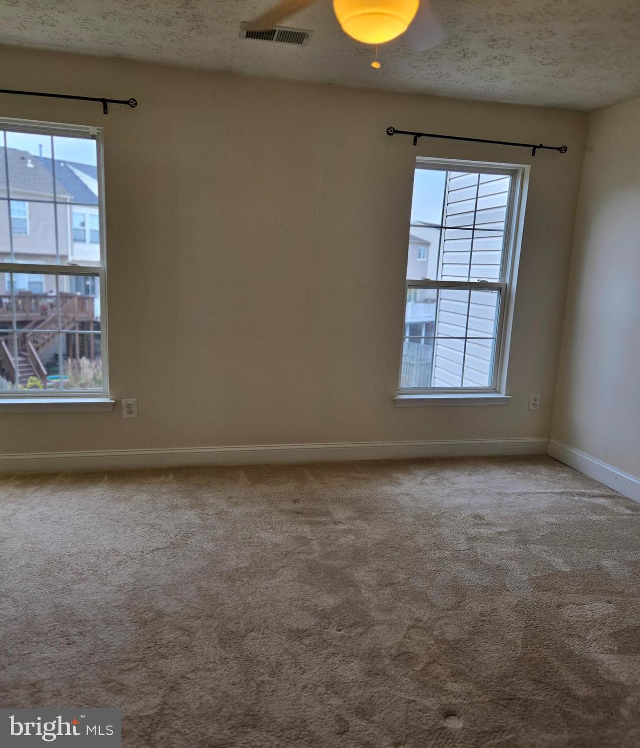 4512 Warm Stone Circle Perry Hall, MD 21128 - Photo 20 of 38 an empty room with windows