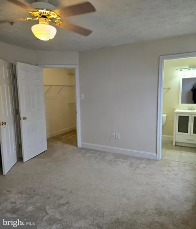 an empty room with a mirror and vanity