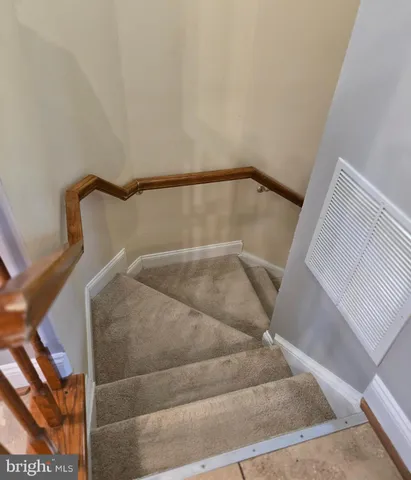 a view of staircase with white walls