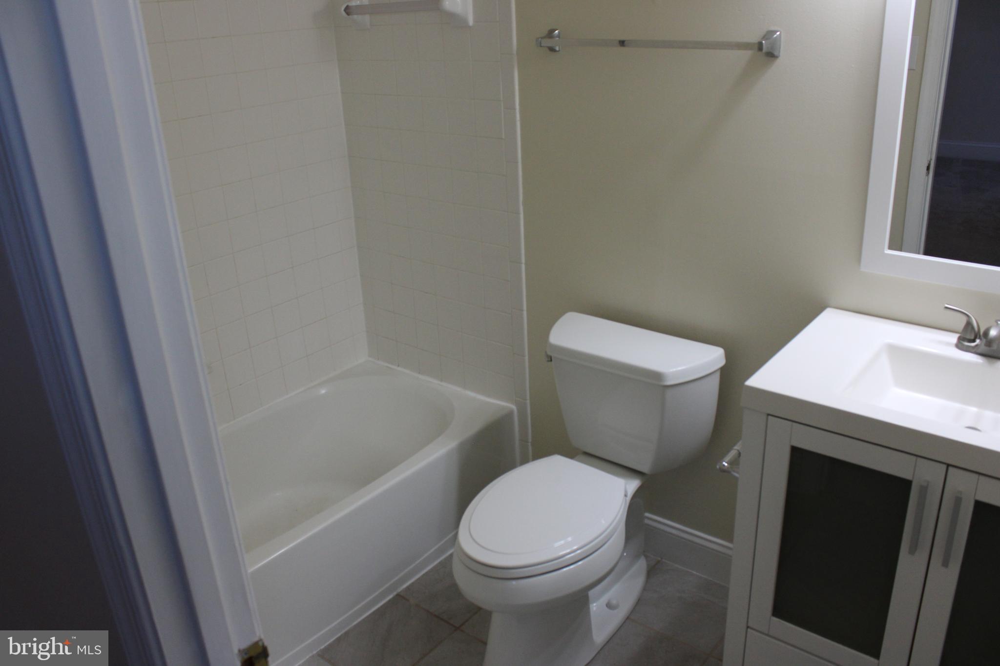 4512 Warm Stone Circle Perry Hall, MD 21128 - Photo 27 of 38 a white toilet sitting next to a bath tub