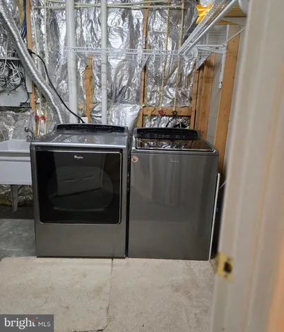 a utility room with washer and dryer