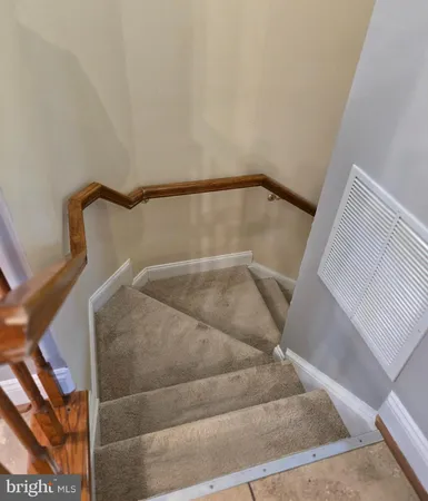 a view of staircase with white walls