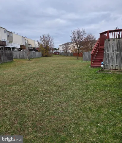 a view of a house with backyard porch and sitting area
