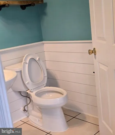 a bathroom with a toilet and a sink