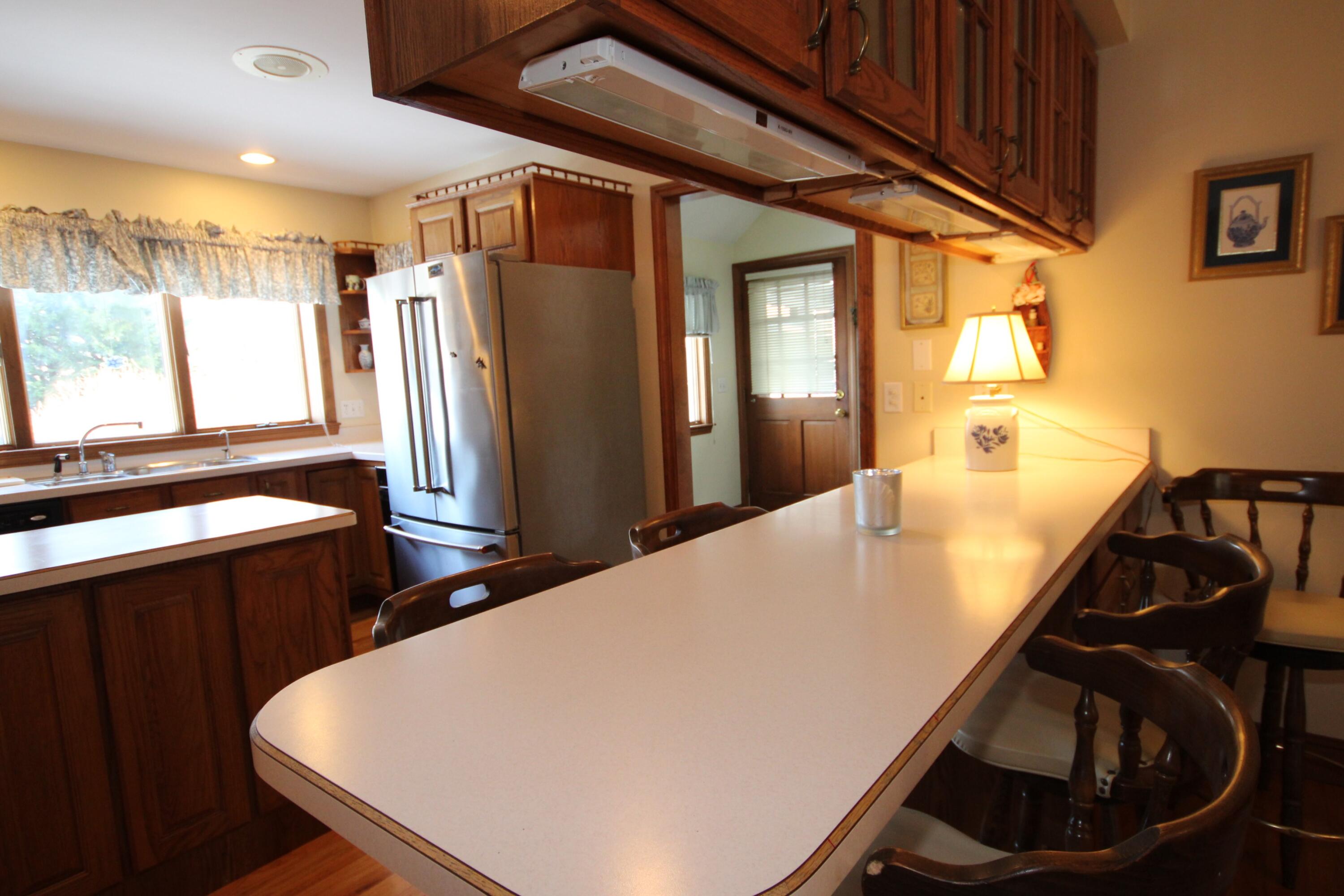 90 Swing Lane Falmouth, MA 02540 - Photo 19 of 43 a view of a living room with furniture and a window