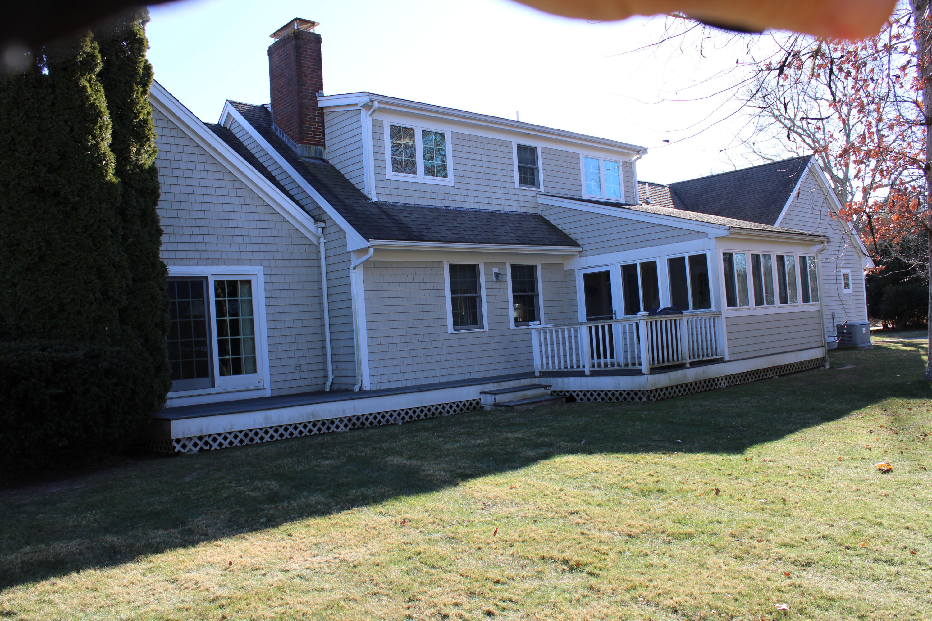 90 Swing Lane Falmouth, MA 02540 - Photo 2 of 43 a front view of a house with a garden