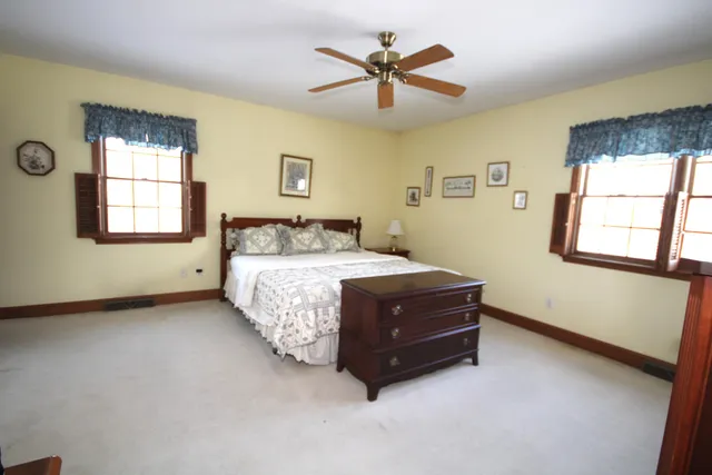 a room with a bed and a window