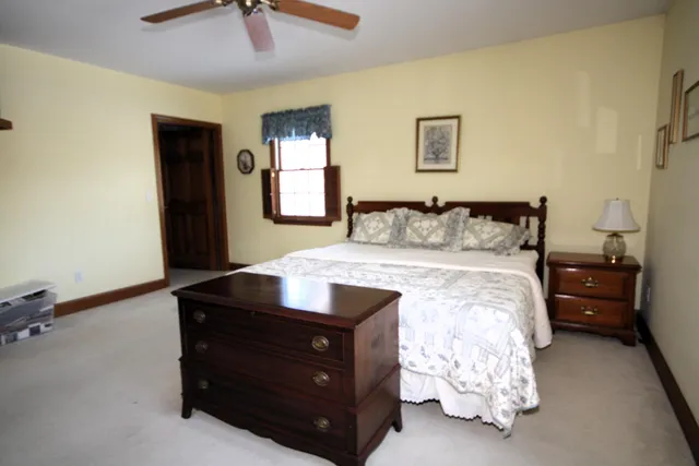 a bed room with a bed and a lamp