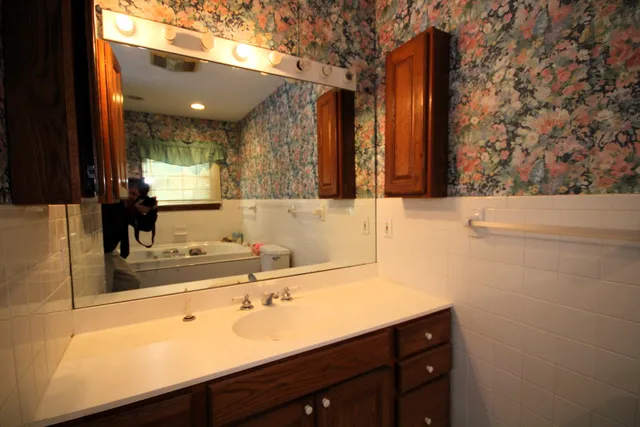 a bathroom with a sink and a mirror