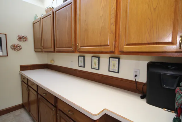 a kitchen with a sink and cabinets