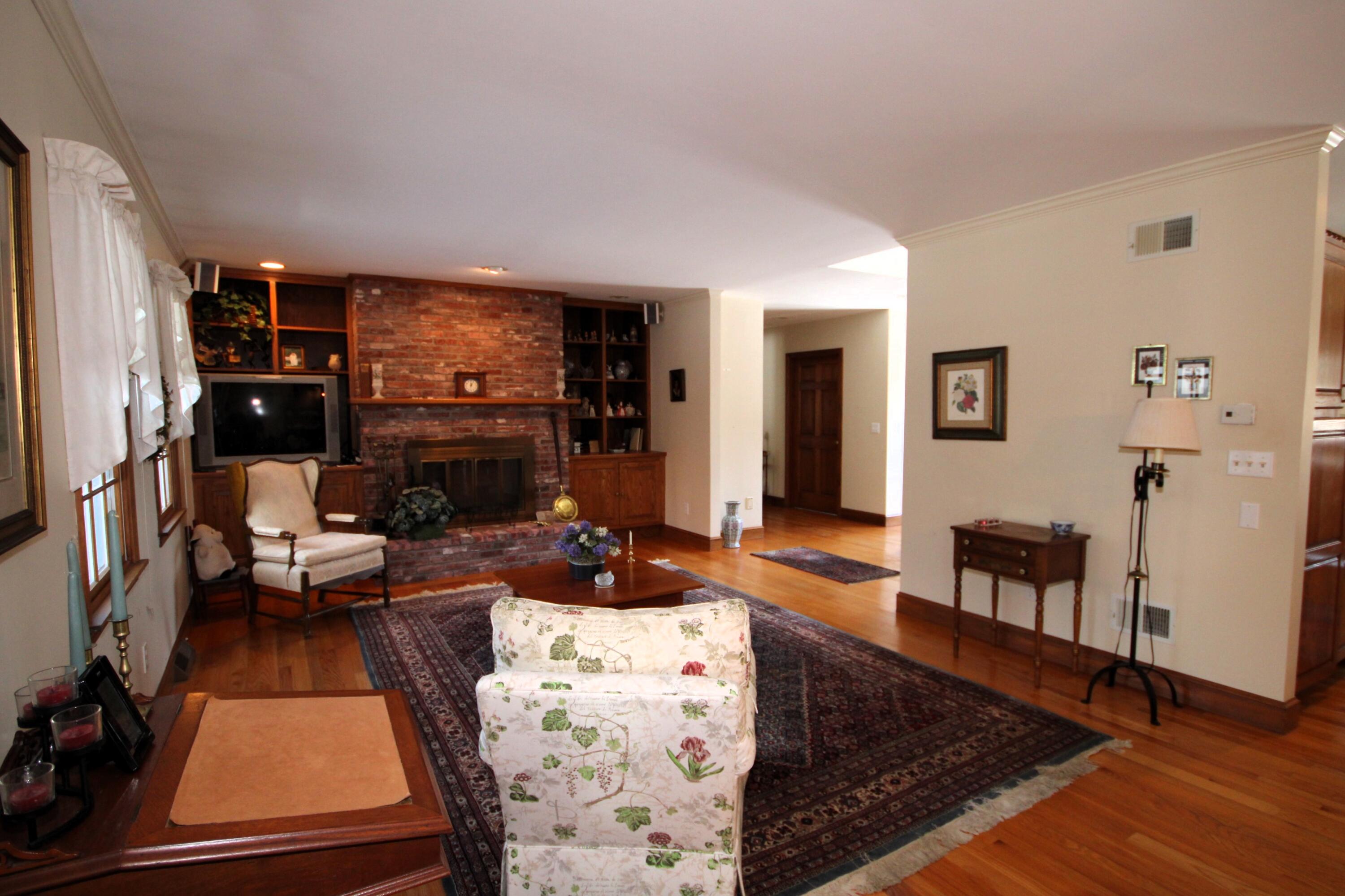 90 Swing Lane Falmouth, MA 02540 - Photo 8 of 43 a living room with furniture fireplace and flat screen tv