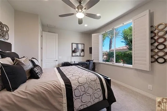 a bedroom with bed and window