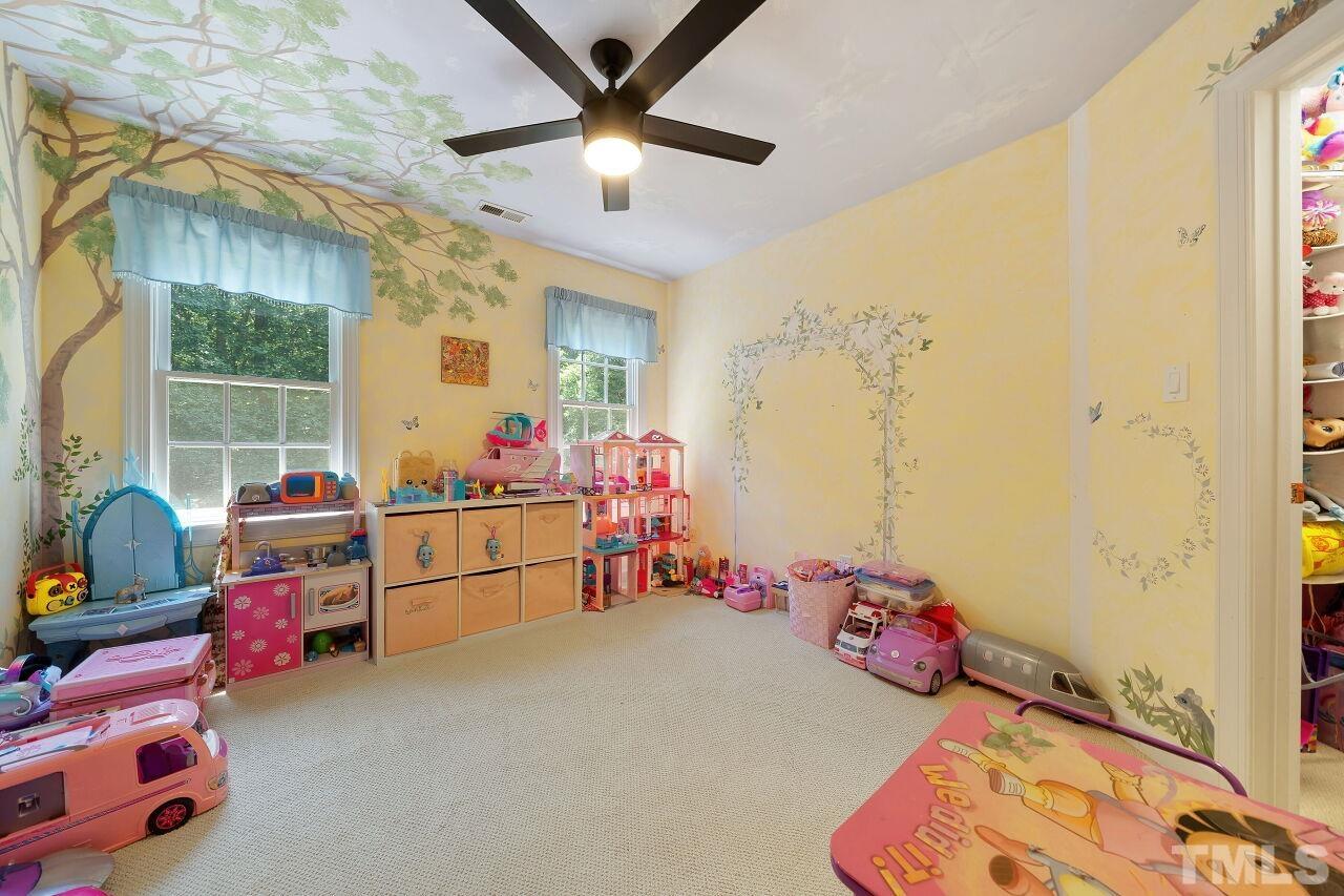 5533 Overleaf Court Raleigh, NC 27615 - Photo 20 of 32 a bedroom with furniture and a window