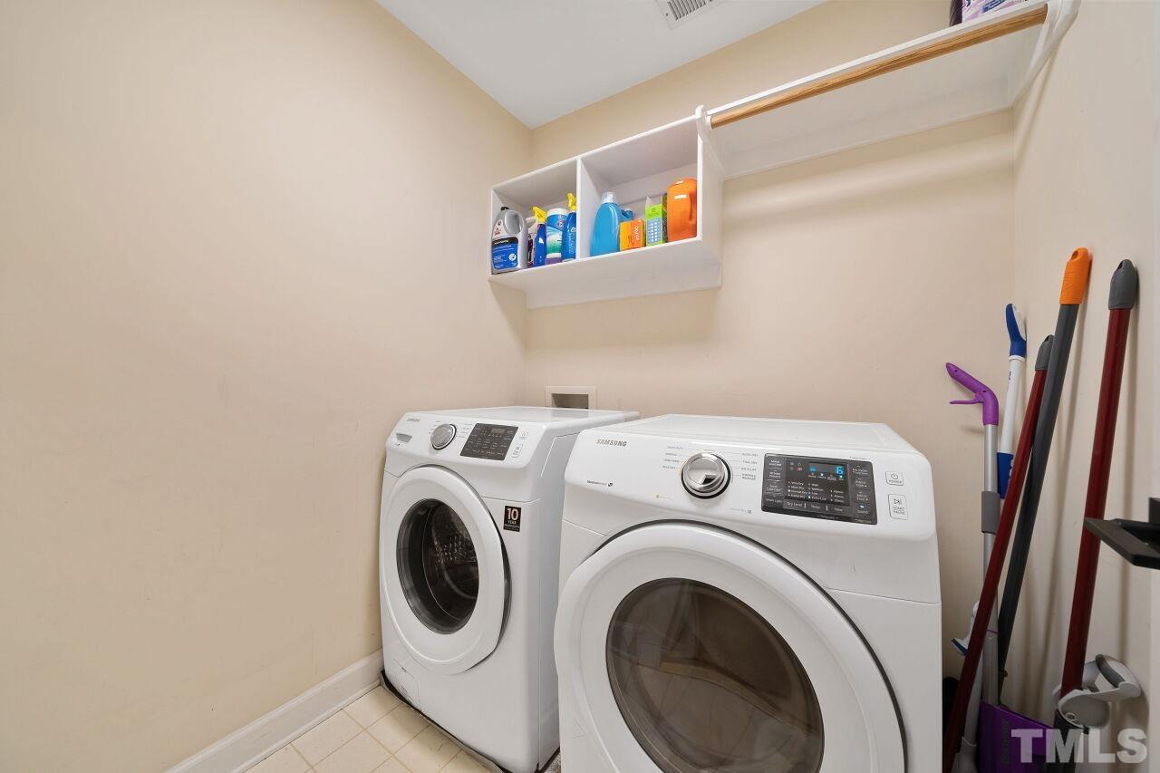 5533 Overleaf Court Raleigh, NC 27615 - Photo 24 of 32 a utility room with dryer and washer