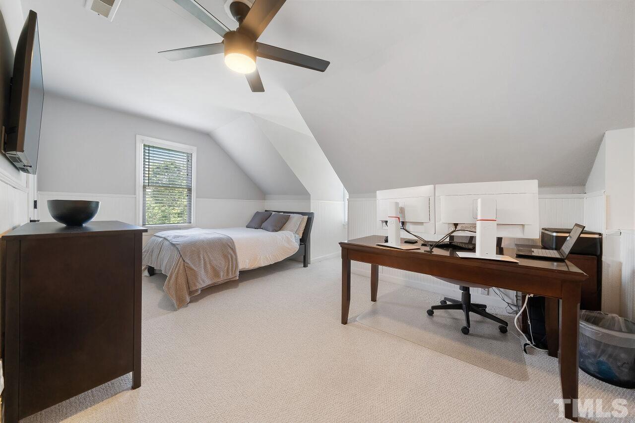 5533 Overleaf Court Raleigh, NC 27615 - Photo 25 of 32 a view of a workspace with furniture and a window