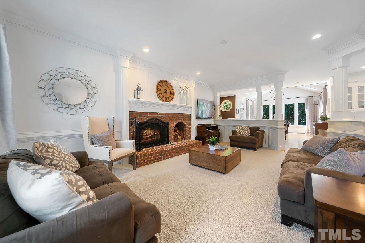 5533 Overleaf Court Raleigh, NC 27615 - Photo 5 of 32 a living room with furniture and a fireplace
