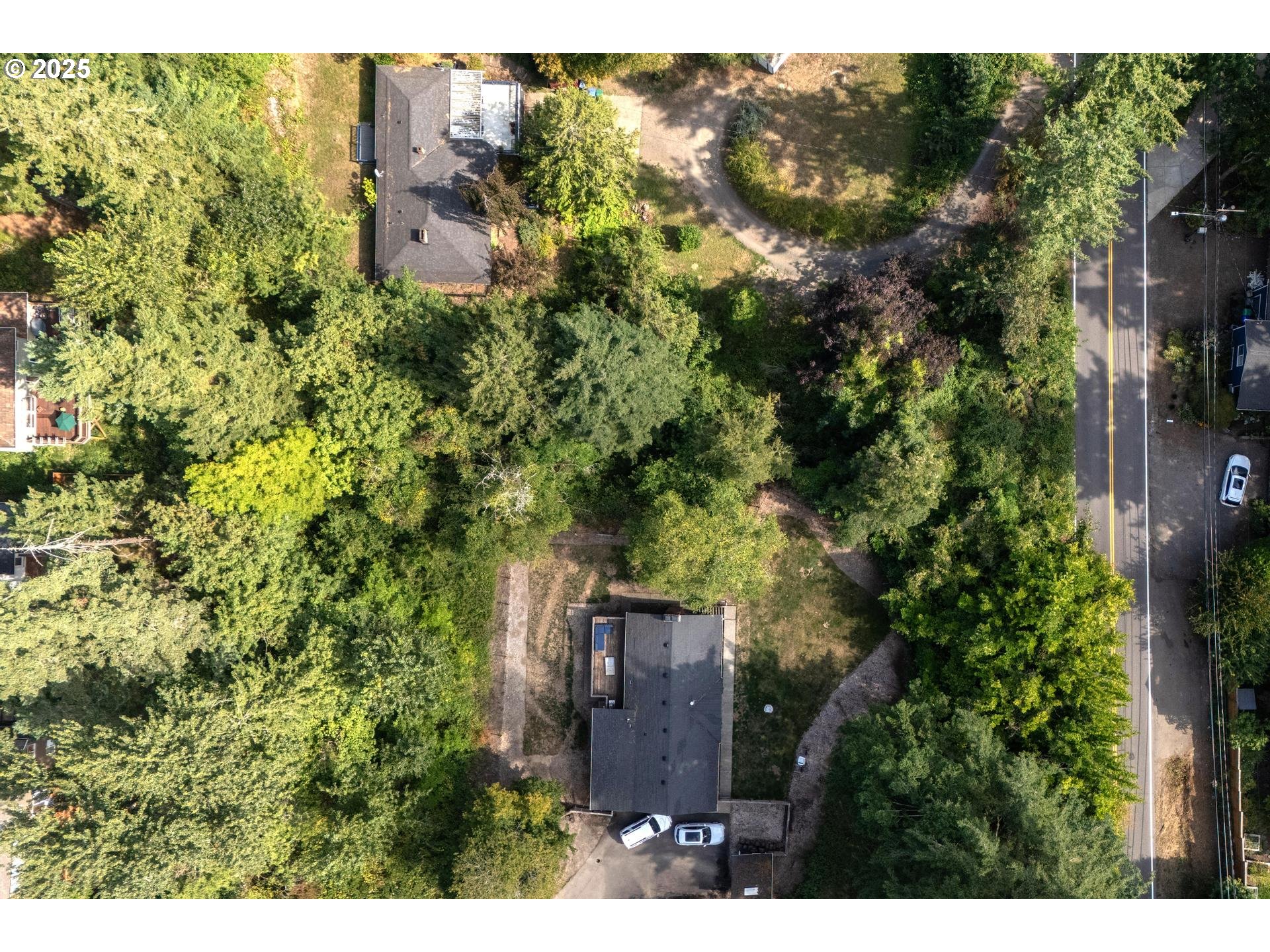 Southwest 43rd Avenue Portland, OR 97219 - Photo 6 of 24 a view of a house with a tree