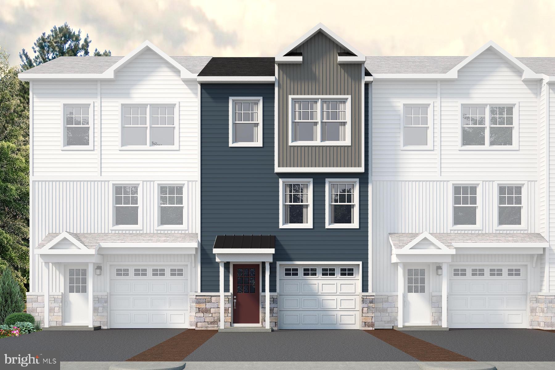 a front view of a residential houses with a street