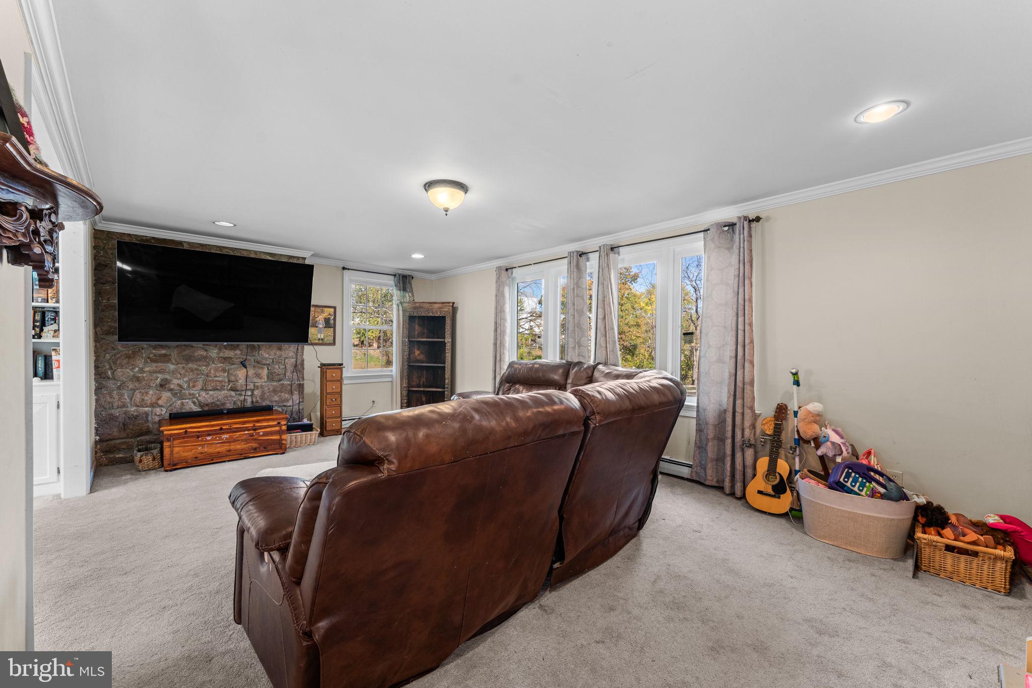 120 Alackness Road Spring City, PA 19475 - Photo 27 of 53 a living room with furniture and a flat screen tv