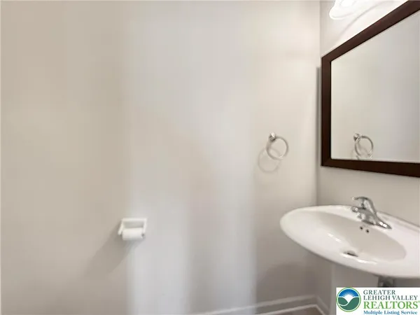 a bathroom with a sink and mirror