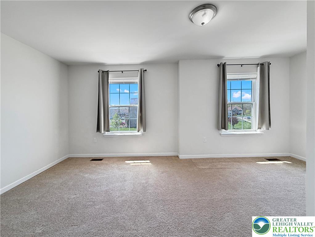 5335 Jutland Road Allentown, PA 18104 - Photo 6 of 13 an empty room with windows