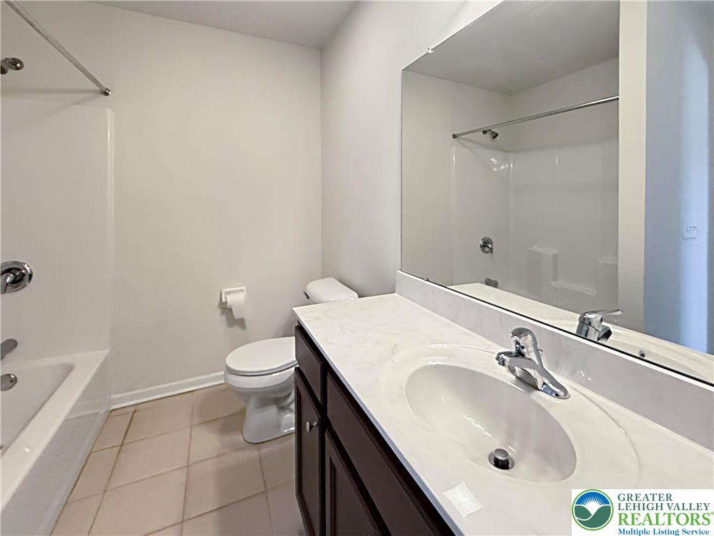 5335 Jutland Road Allentown, PA 18104 - Photo 10 of 13 a bathroom with a sink a toilet and shower