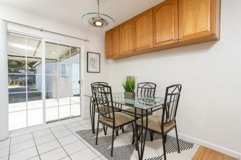 a view of a dining room with furniture and a window