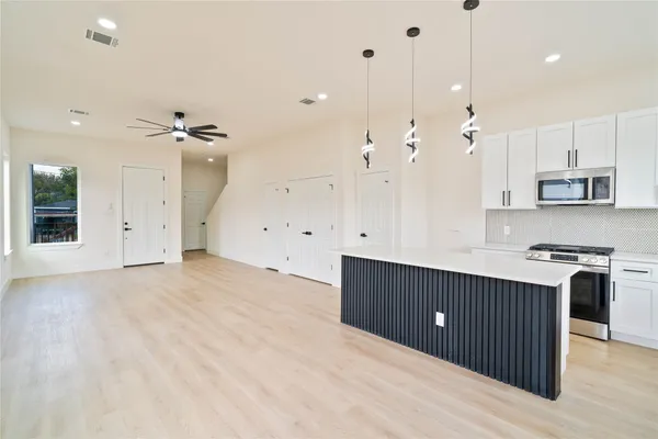 a view of a house with wooden fence