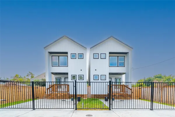 a kitchen with kitchen island a sink and a stove top oven