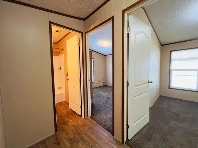 a view of a bathroom from a hallway