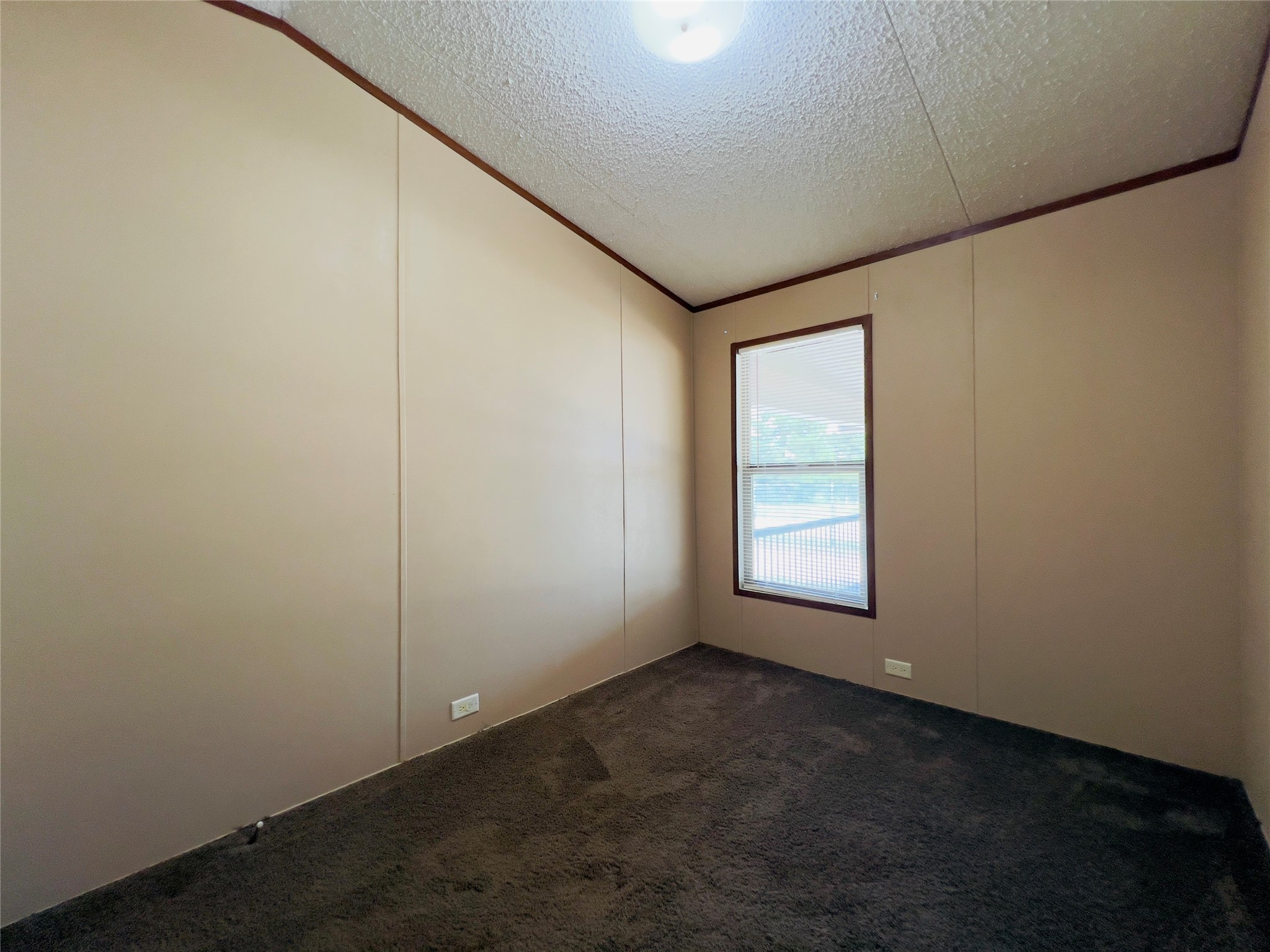 788 County Road 3479 J Cleveland, TX 77327 - Photo 18 of 22 an empty room with a window