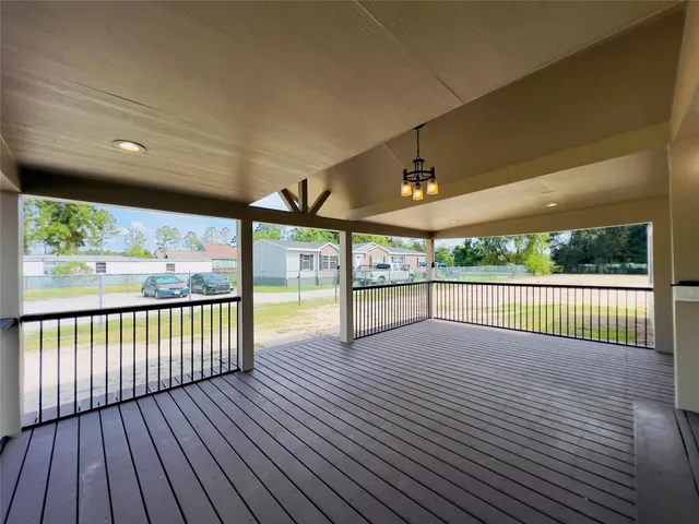 a view of porch with wooden floor