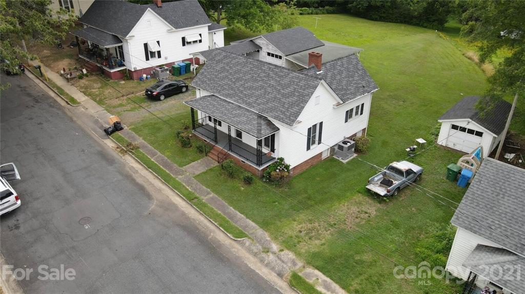 621 Graham Street Albemarle, NC 28001 - Photo 22 of 24 an aerial view of a house with a garden and swimming pool