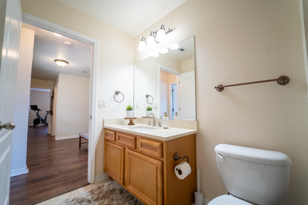 103 6th Avenue Shalimar, FL 32579 - Photo 14 of 23 a bathroom with a toilet sink and mirror