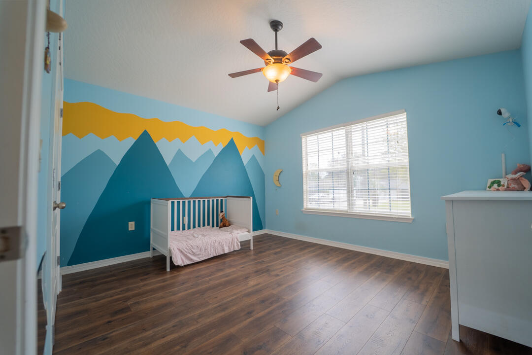 103 6th Avenue Shalimar, FL 32579 - Photo 16 of 23 a view of front door and bedroom with wooden floor