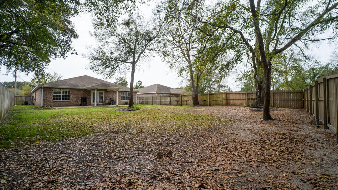 103 6th Avenue Shalimar, FL 32579 - Photo 22 of 23 a front view of a house with a yard
