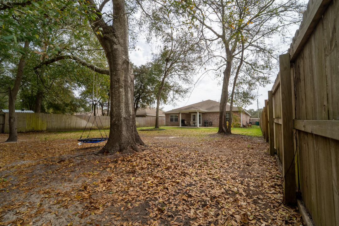 103 6th Avenue Shalimar, FL 32579 - Photo 23 of 23 a tree in the garden of the house