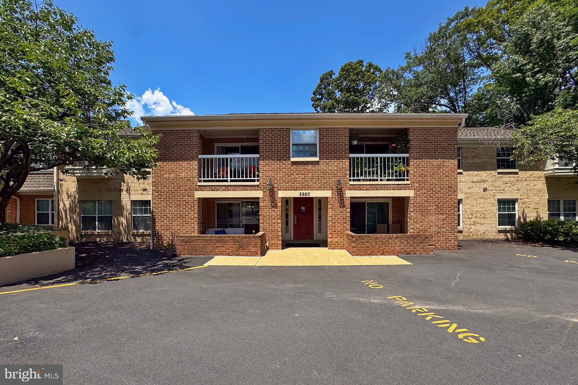 5920 Cove Landing Road, Unit 102 Burke, VA 22015 - Photo 1 of 45 front view of a house with a street