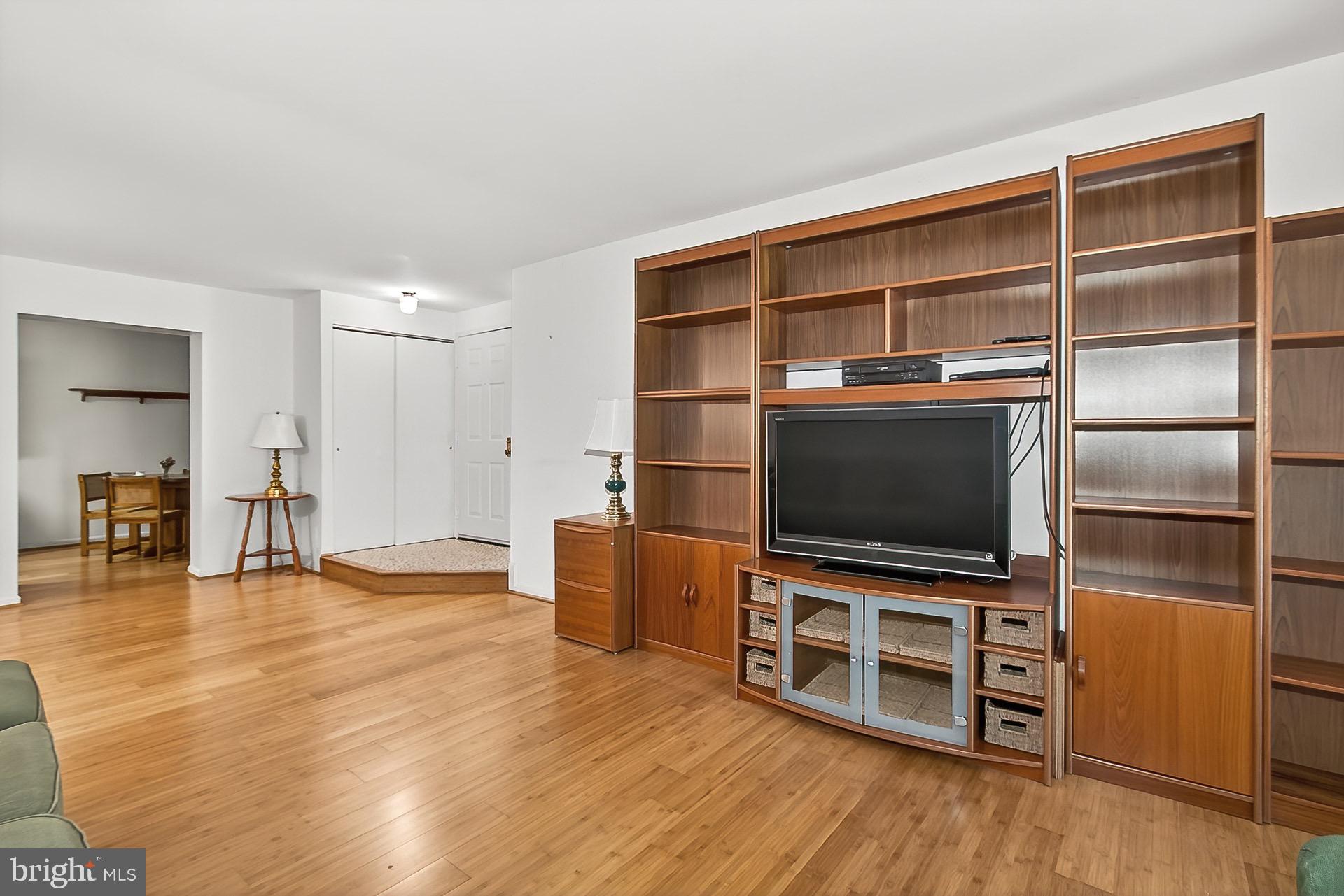 5920 Cove Landing Road, Unit 102 Burke, VA 22015 - Photo 15 of 45 a view of a livingroom with furniture and wooden floor