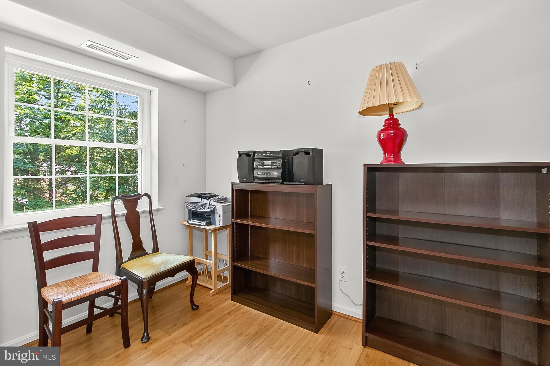 5920 Cove Landing Road, Unit 102 Burke, VA 22015 - Photo 17 of 45 a view of a livingroom with furniture and a window